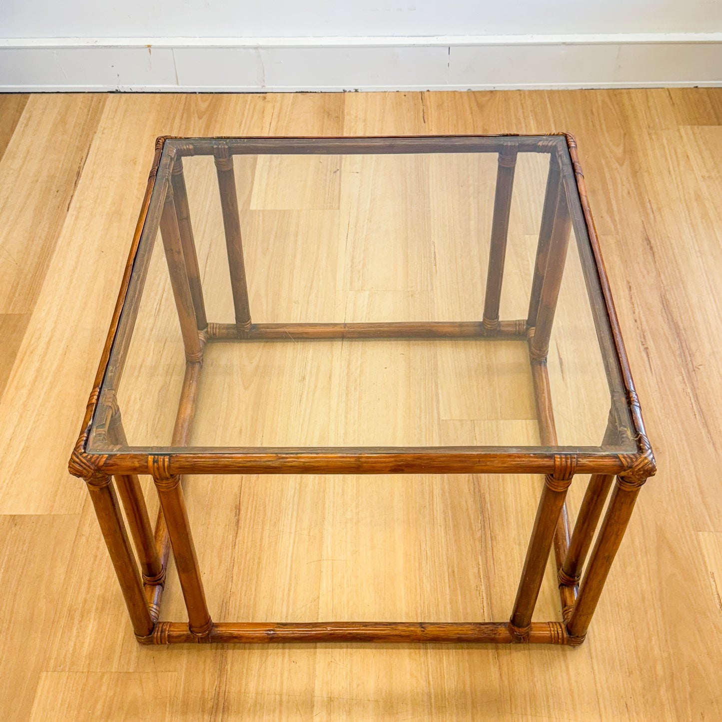 Vintage glass topped cane coffee tables