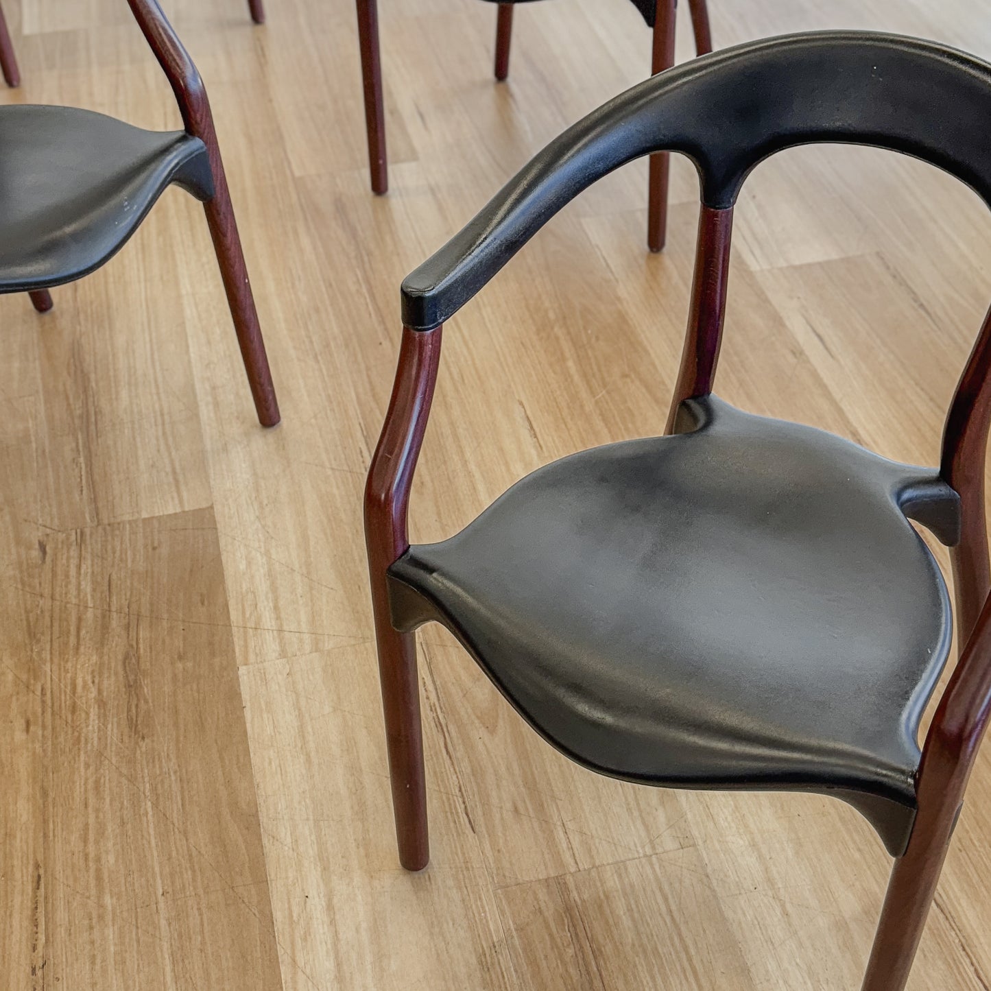 Set of four teak and acrylic dining chairs