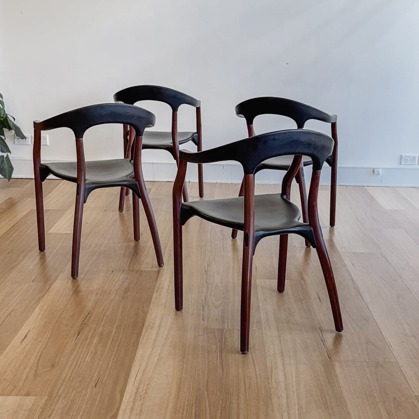 Set of four teak and acrylic dining chairs