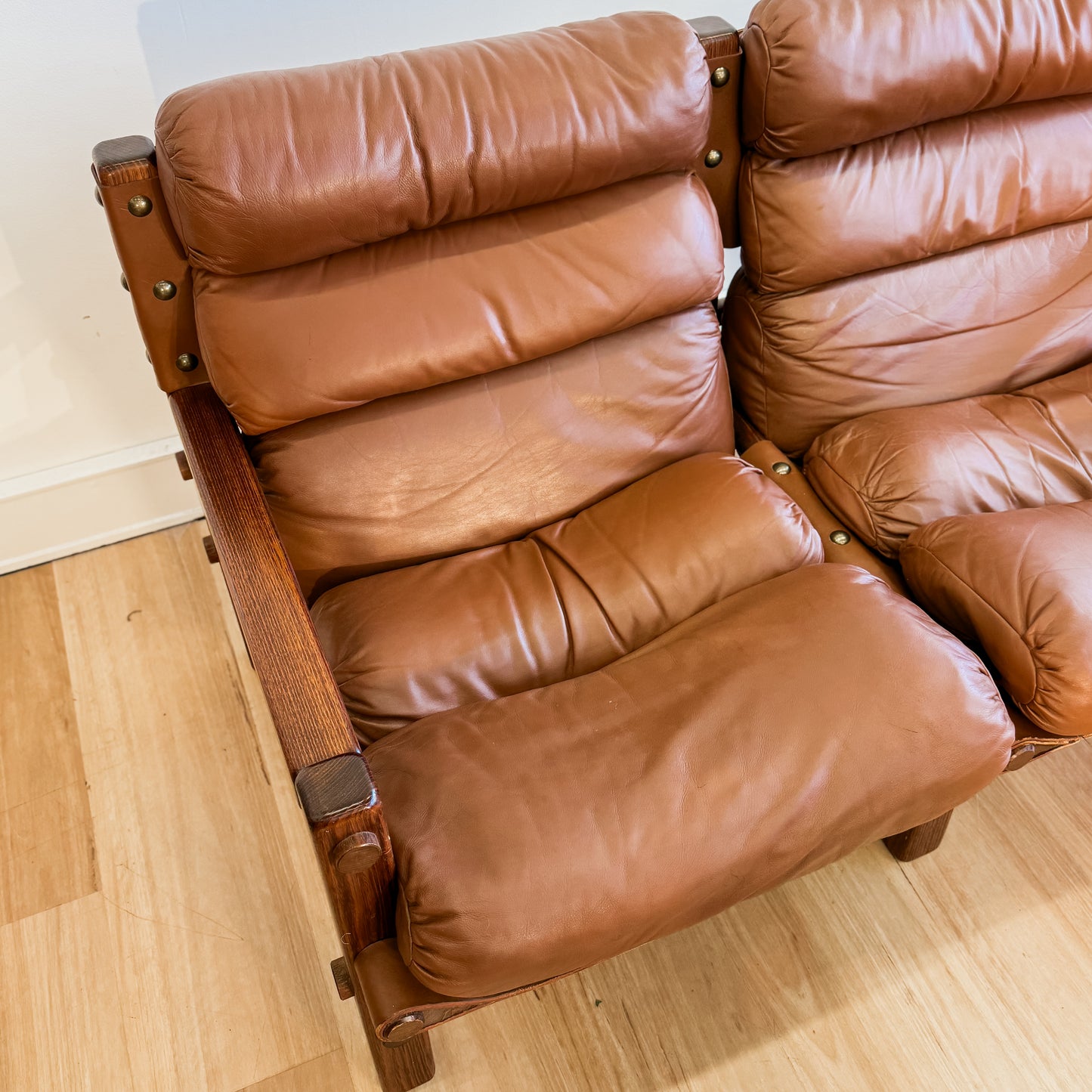 Norman Archibald 1970s ‘Nore’ vintage two seater leather sofa