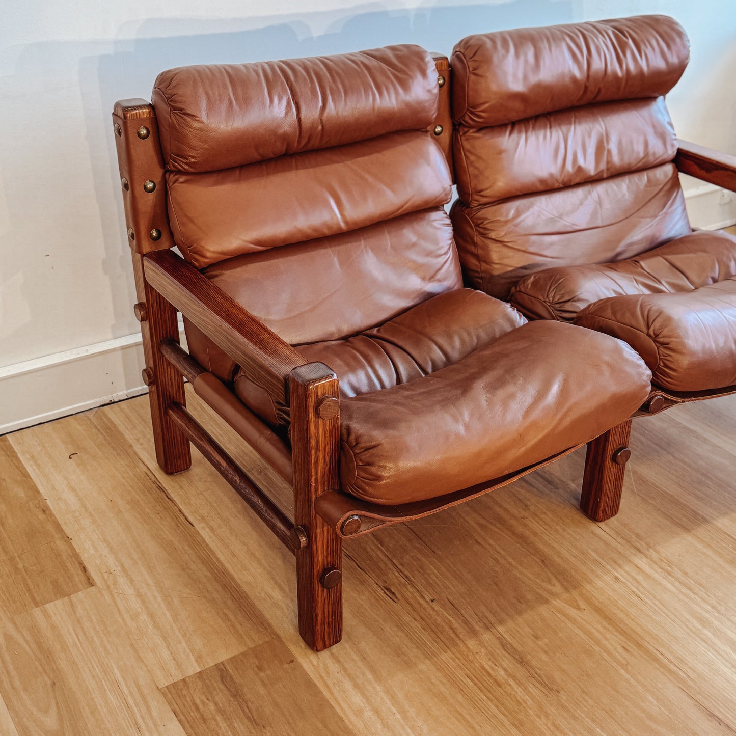 Norman Archibald 1970s ‘Nore’ vintage two seater leather sofa