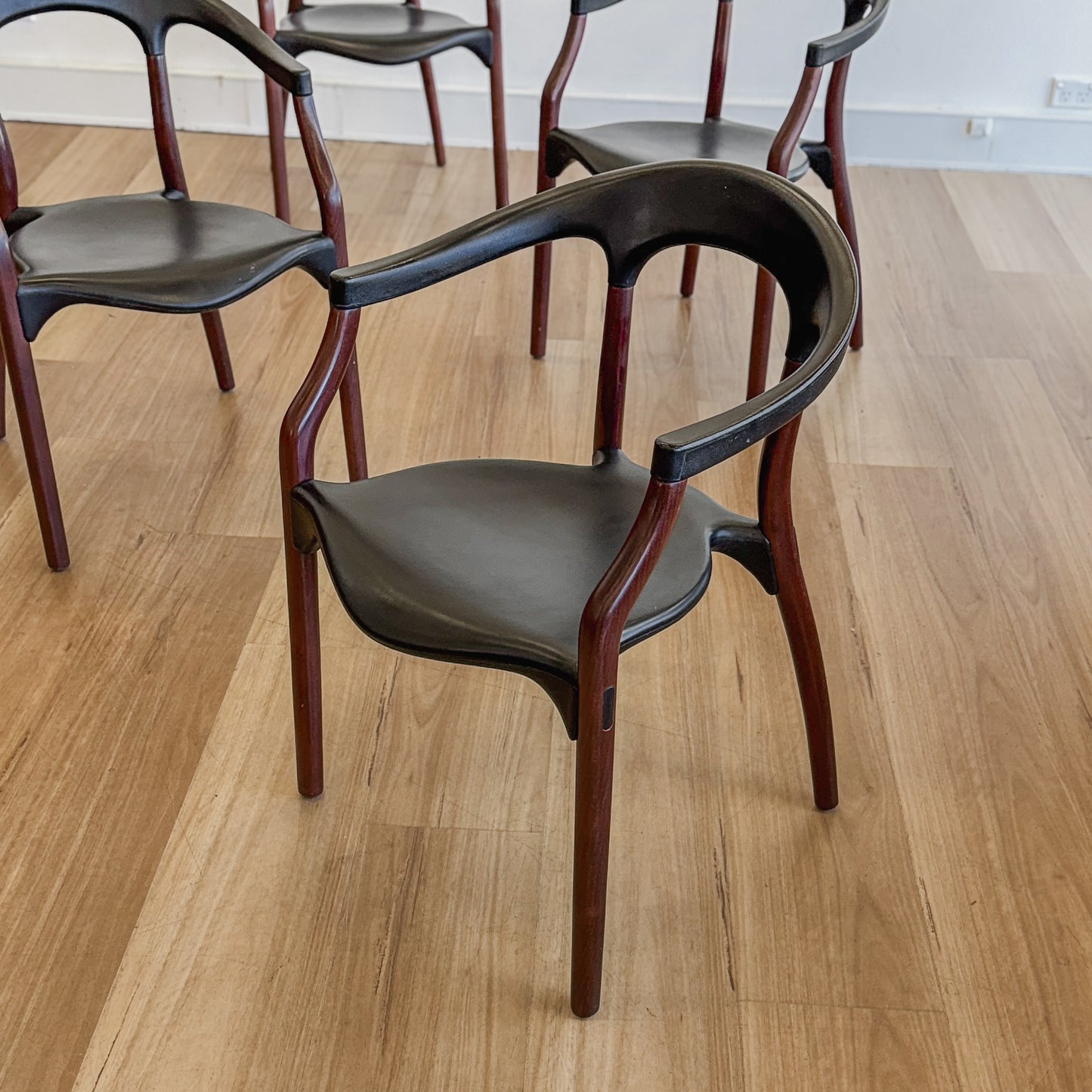 Set of four teak and acrylic dining chairs