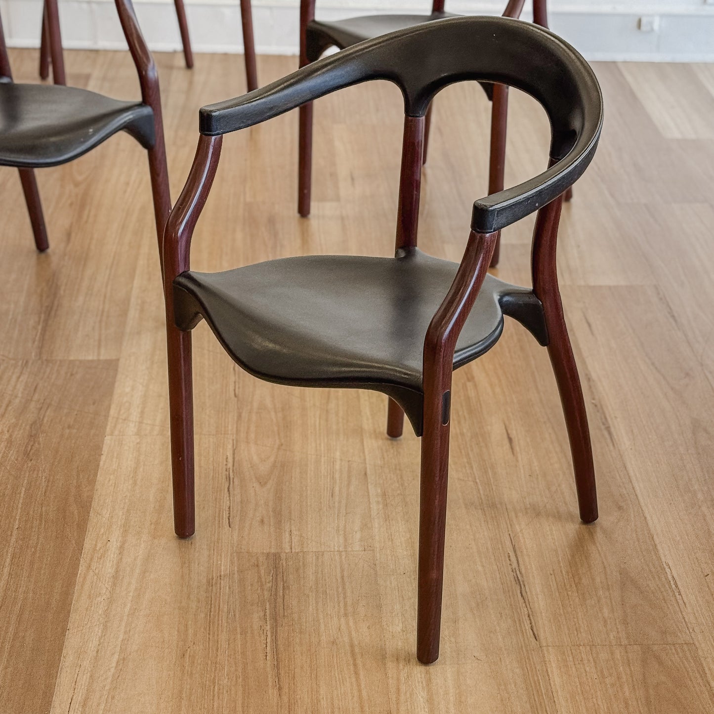 Set of four teak and acrylic dining chairs