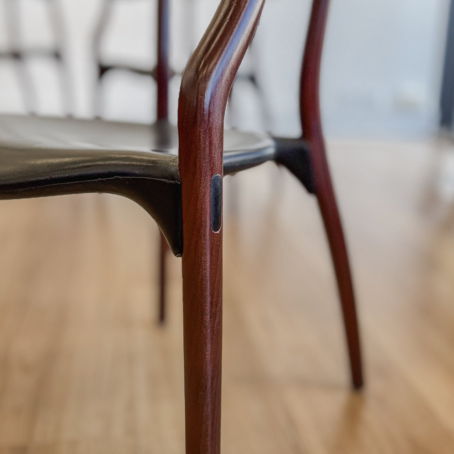 Set of four teak and acrylic dining chairs