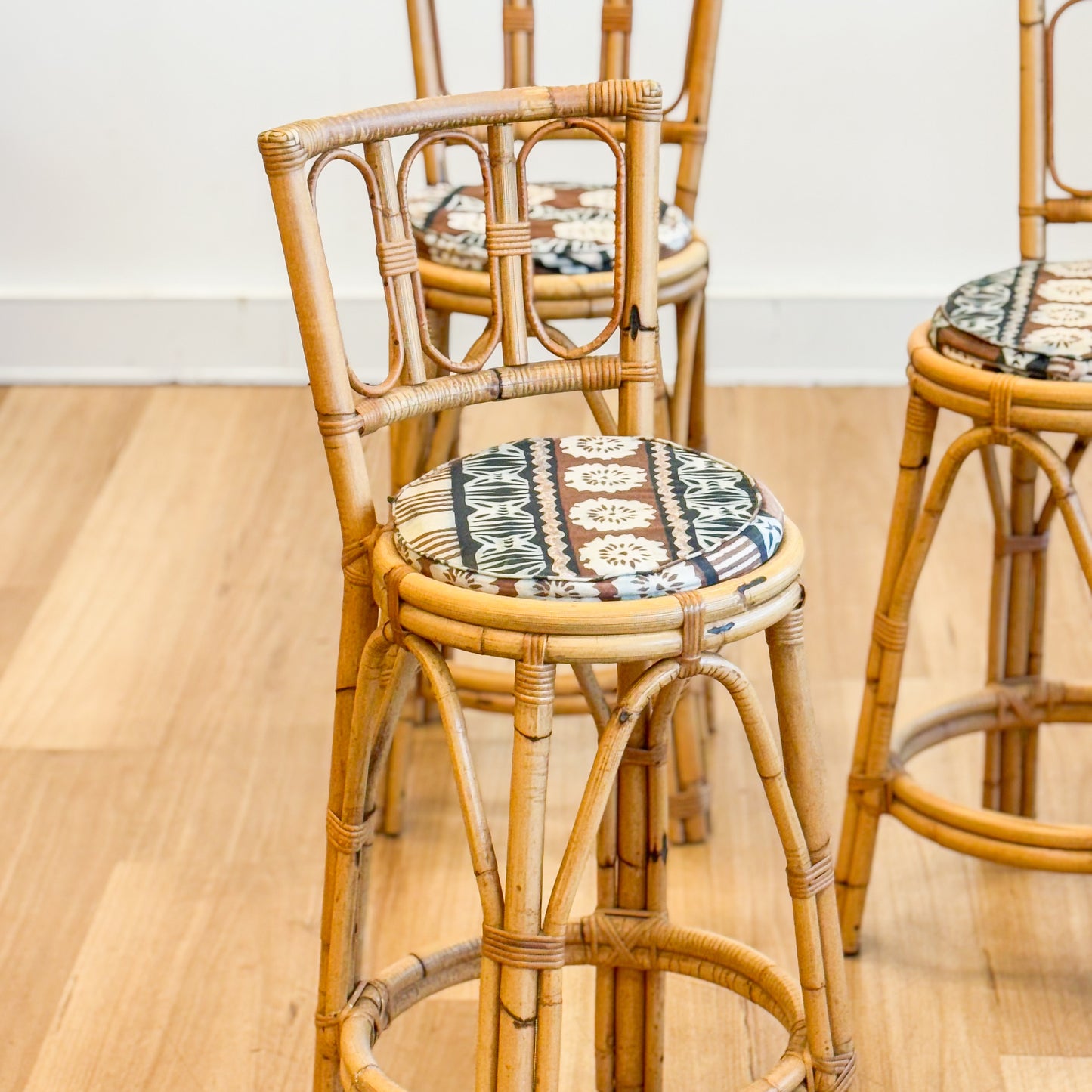 Set of three cane bar stools