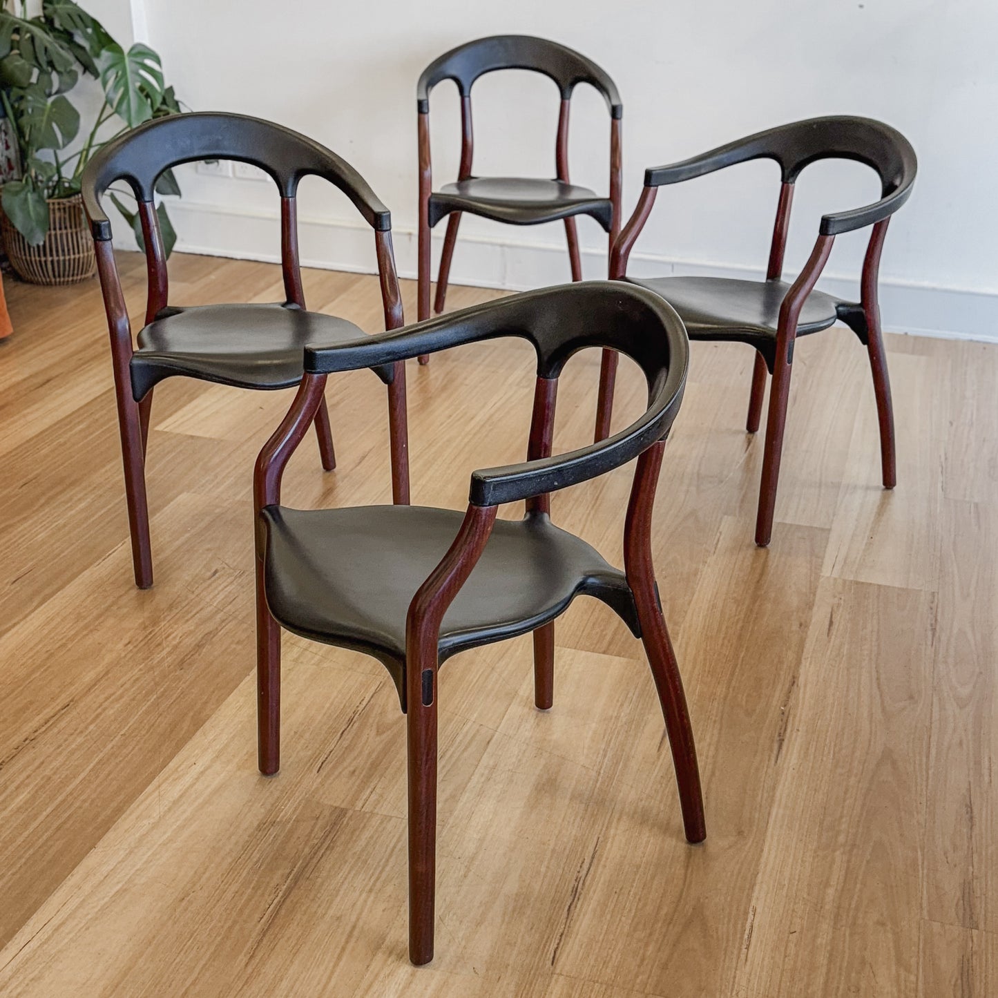 Set of four teak and acrylic dining chairs