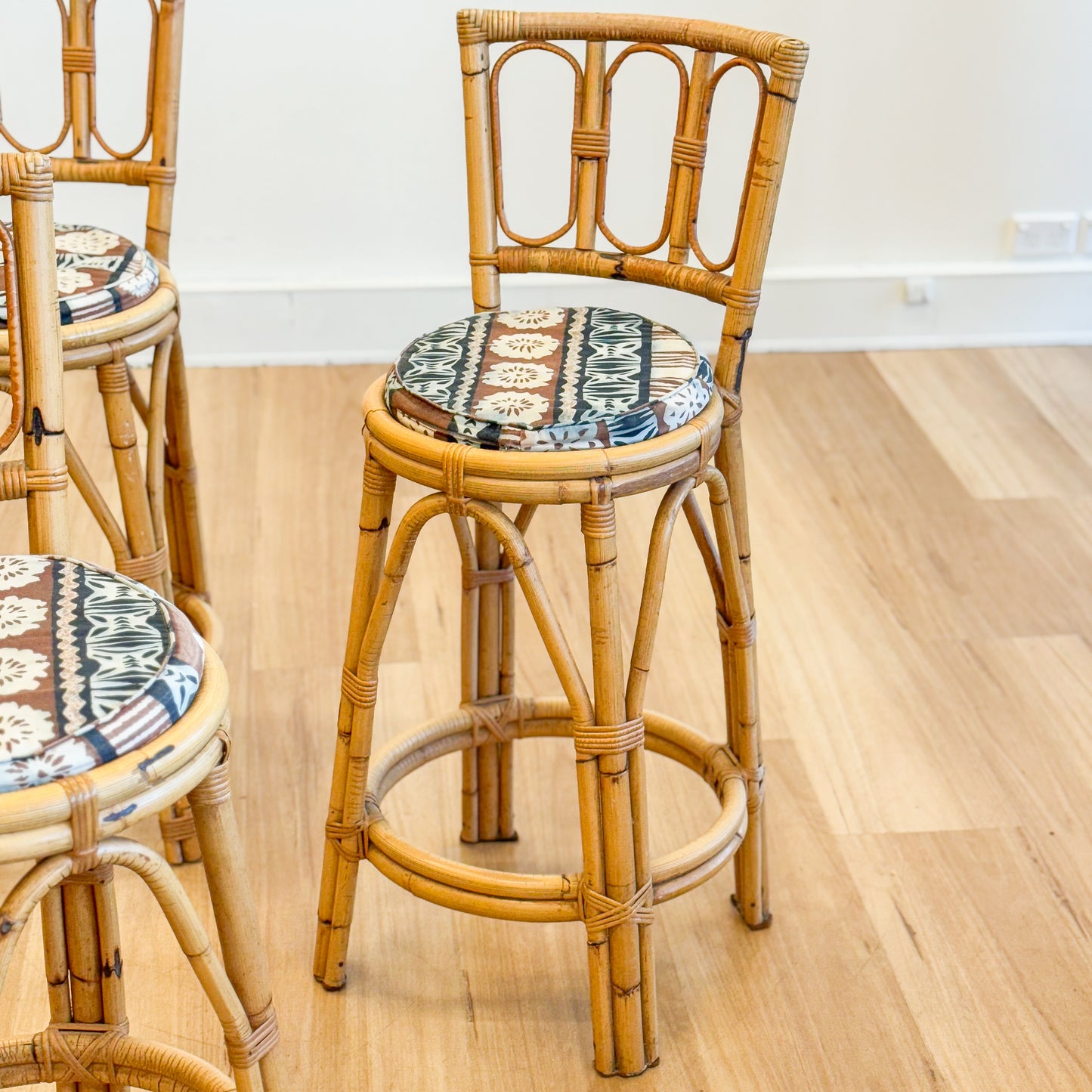 Set of three cane bar stools