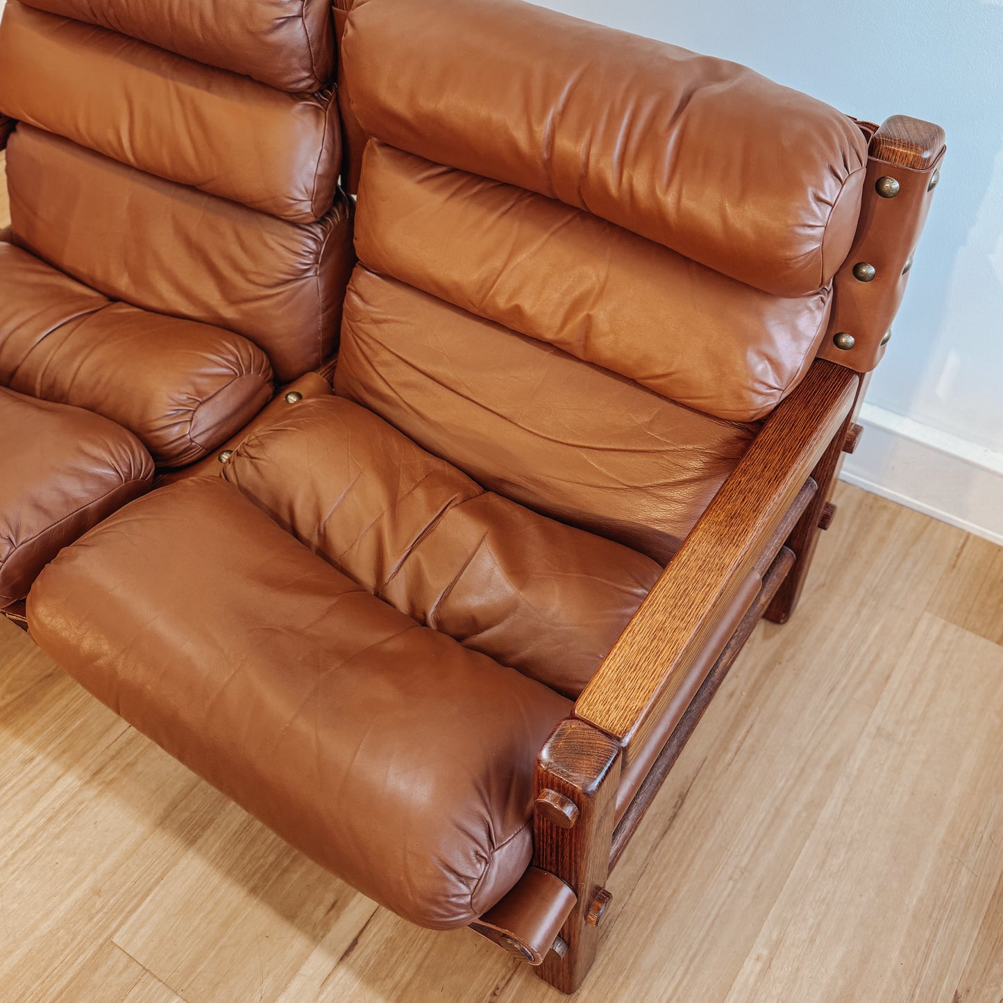 Norman Archibald 1970s ‘Nore’ vintage two seater leather sofa