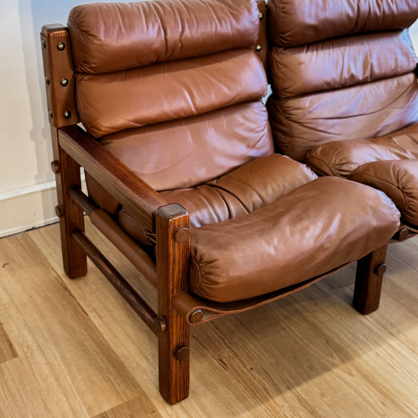 Norman Archibald 1970s ‘Nore’ vintage two seater leather sofa