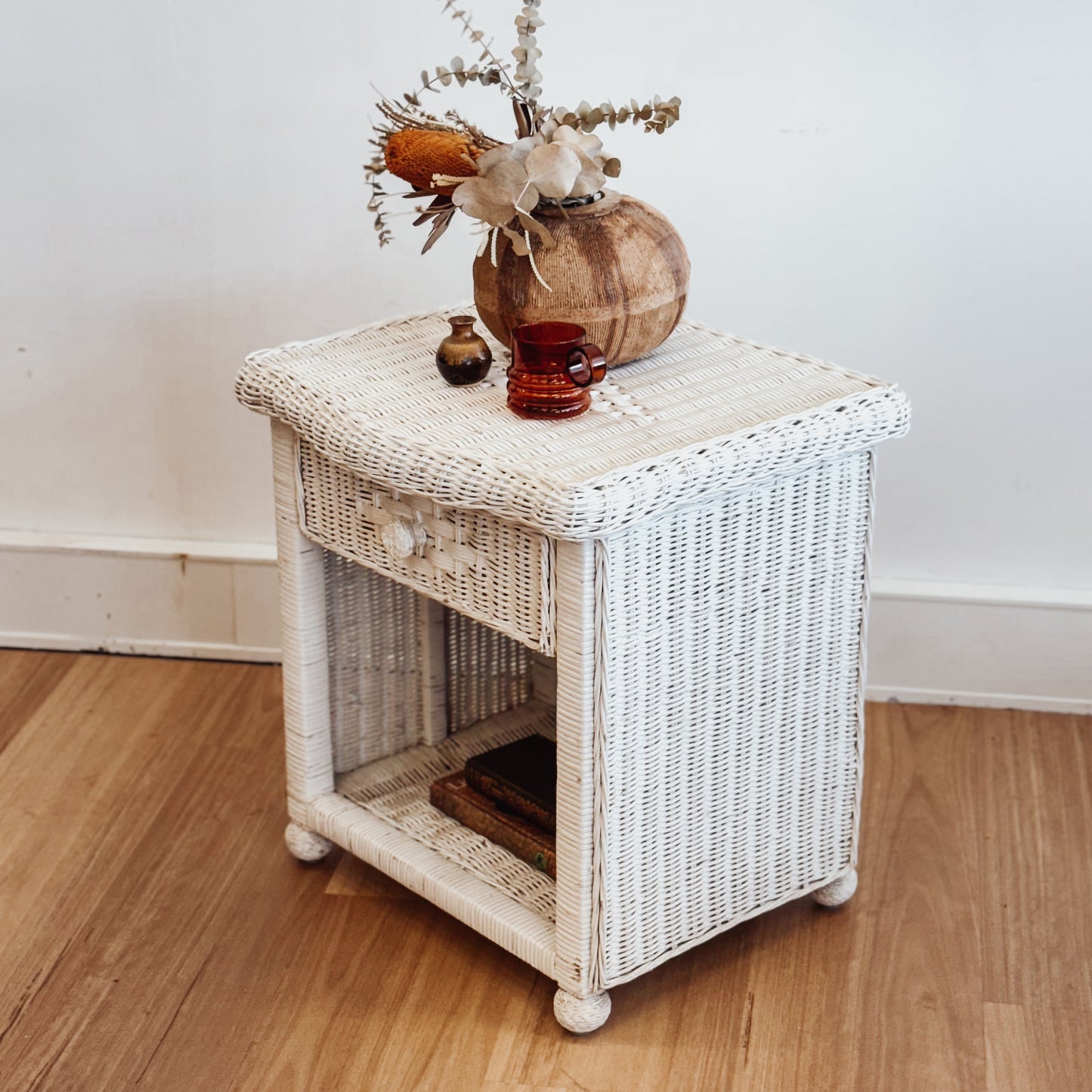 Vintage white painted cane bedside table