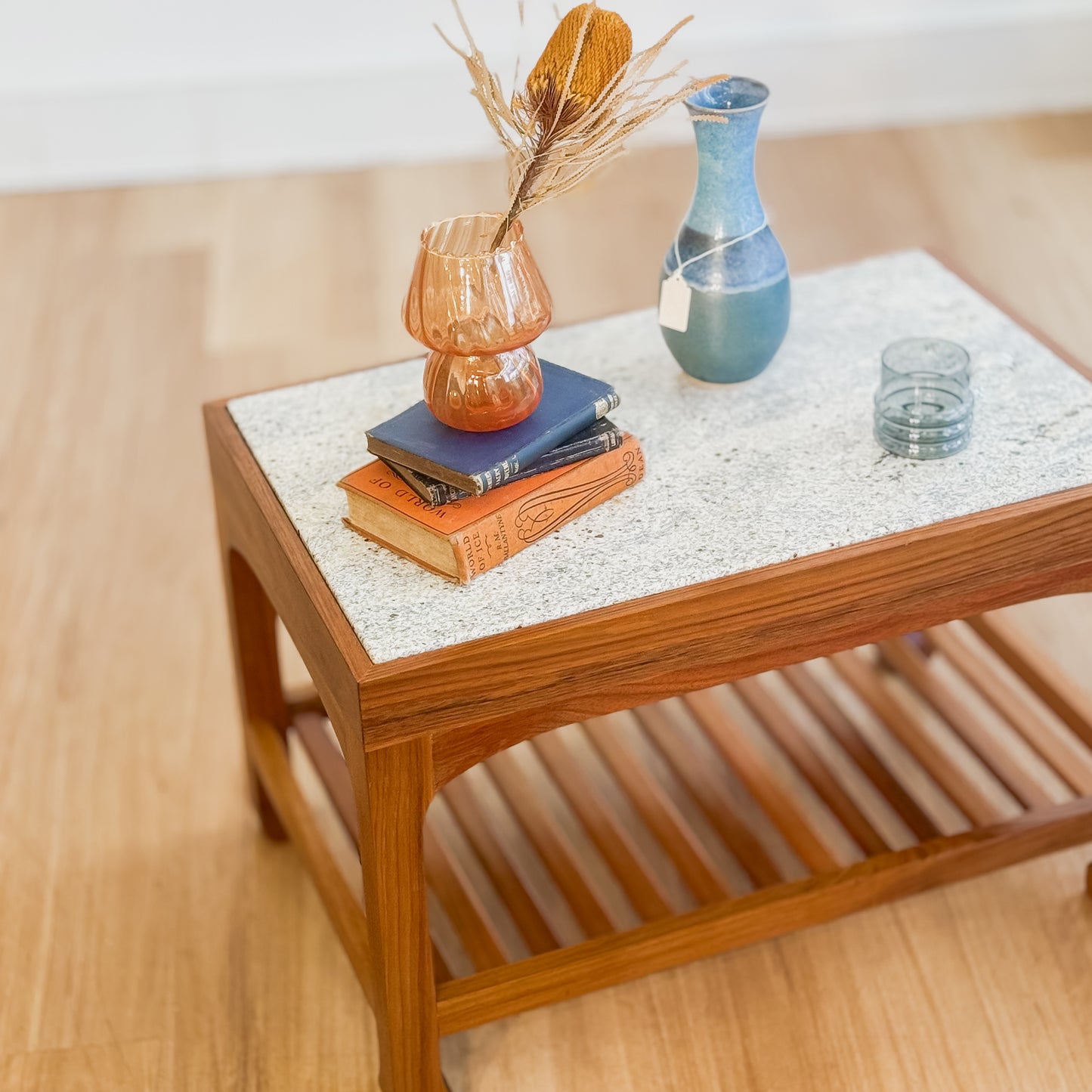 Stone top coffee table with slatted shelf underneath