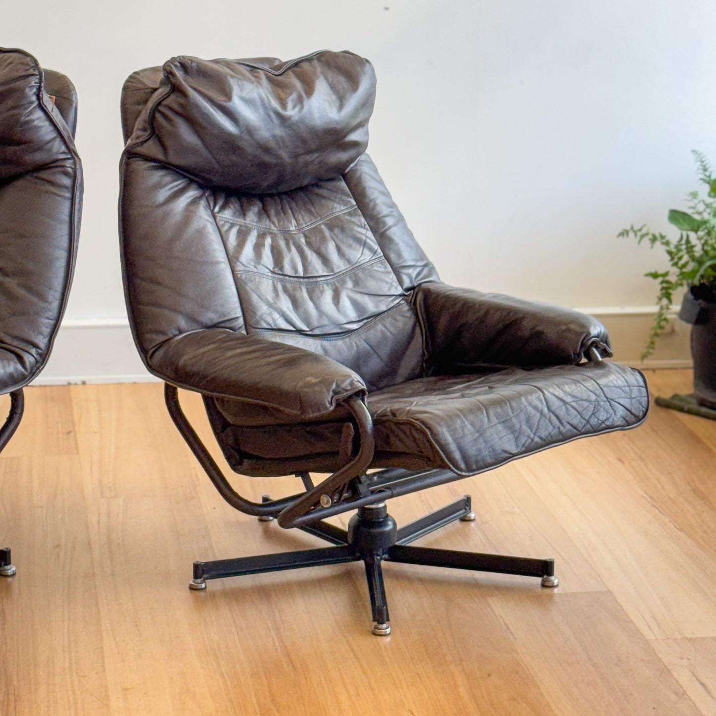 Skoghaug Industries - reclining swivel armchairs upholstered in khaki brown leather