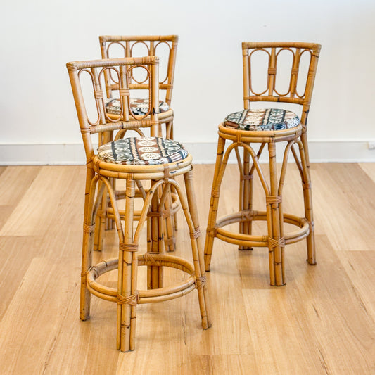 Set of three cane bar stools
