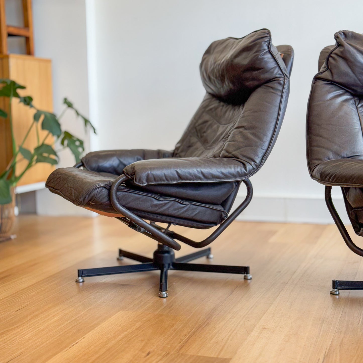 Skoghaug Industries - reclining swivel armchairs upholstered in khaki brown leather