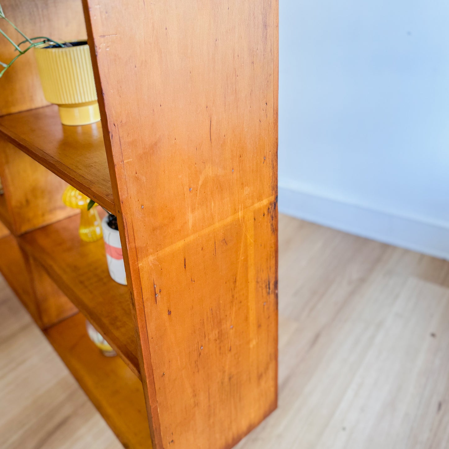 Mid century pigeonhole bookshelf on cigar legs
