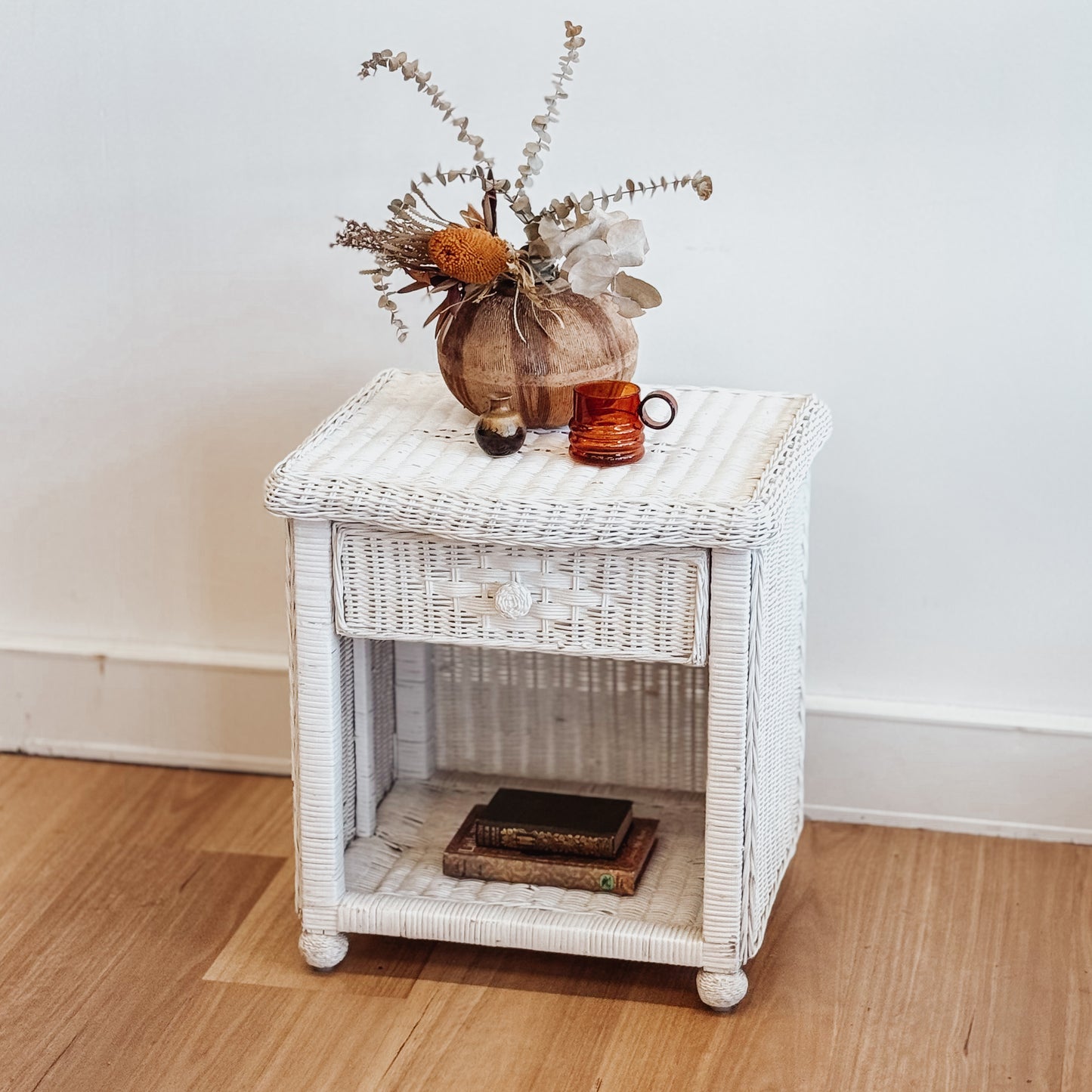 Vintage white painted cane bedside table
