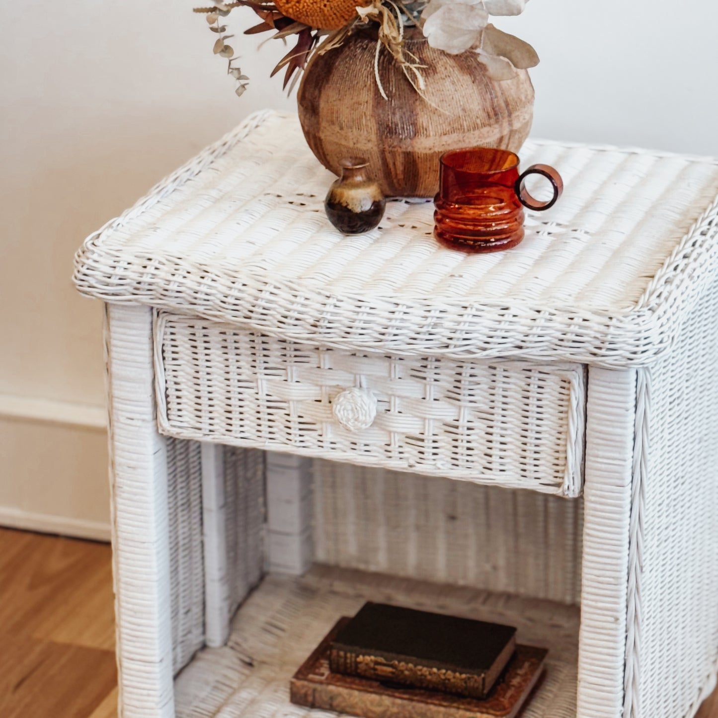 Vintage white painted cane bedside table