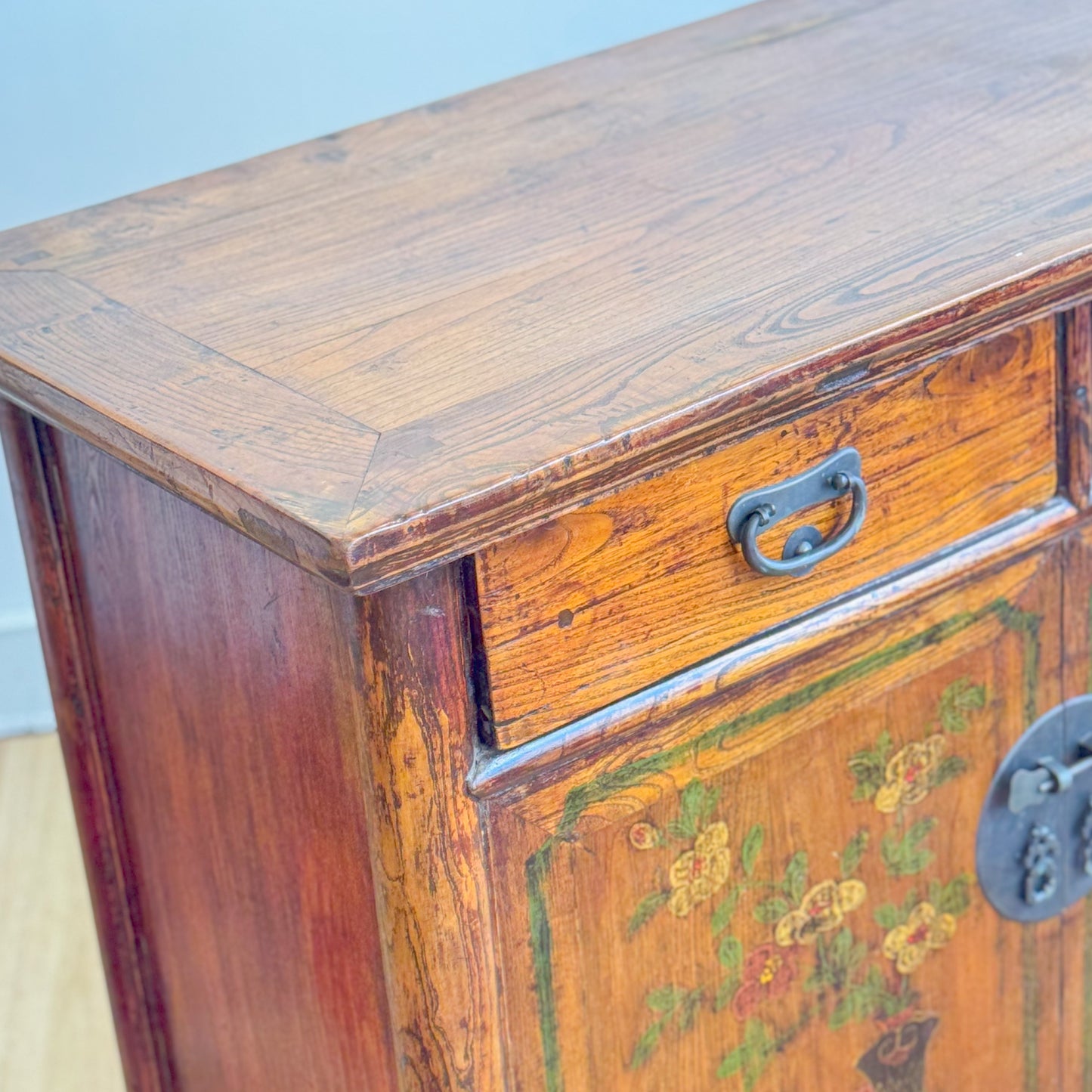 Nepalese hardwood cabinet with floral painted doors and brass fittings