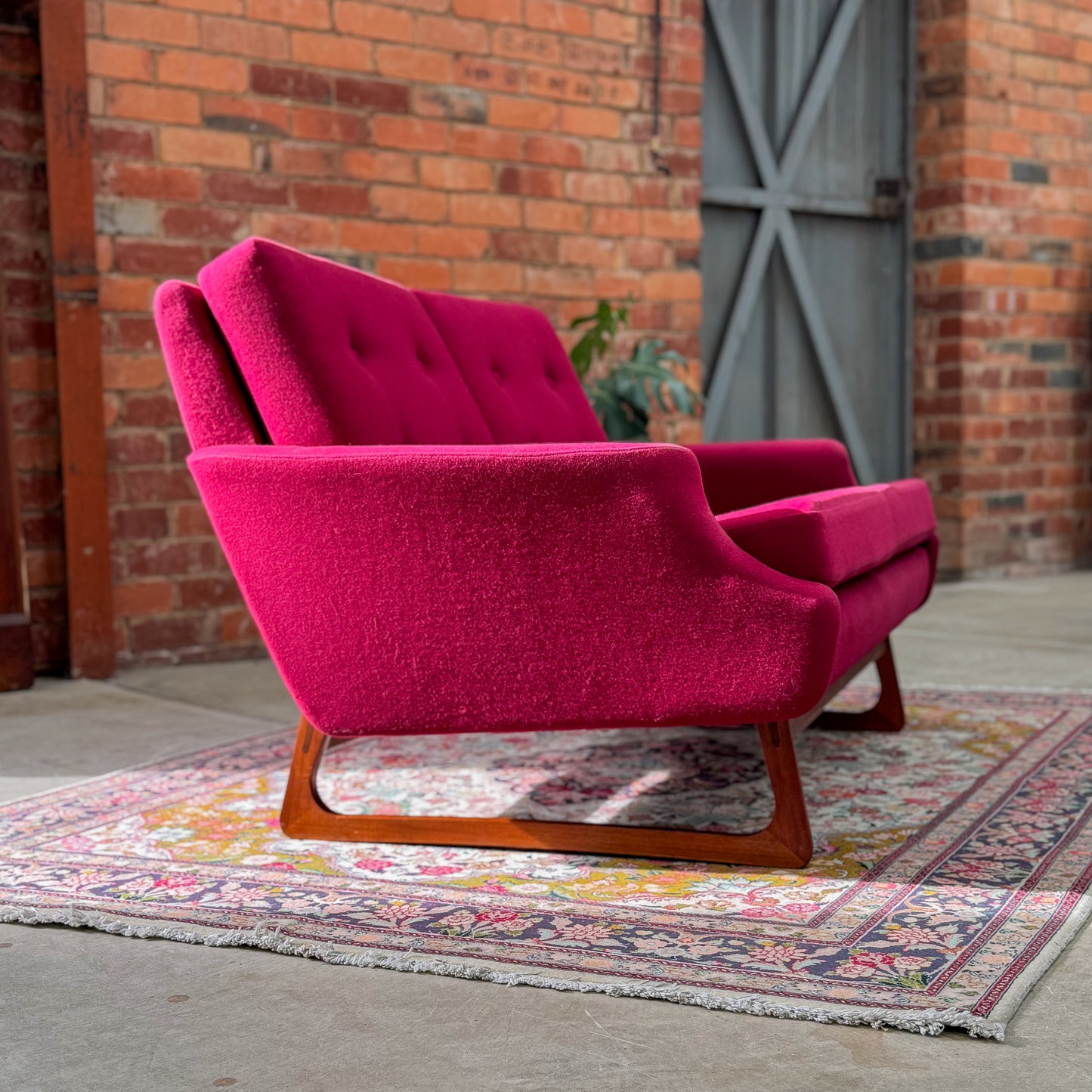 1960s Parker two seater sofa on a sleigh base with exposed dowel detail
