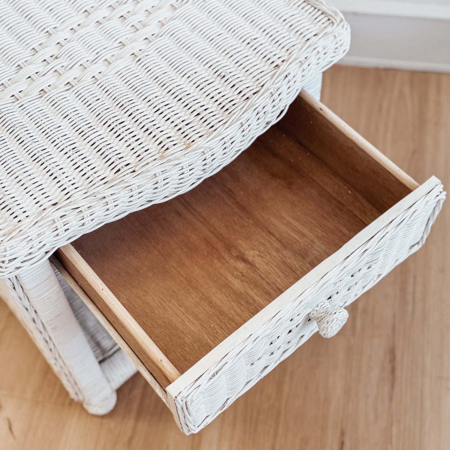 Vintage white painted cane bedside table