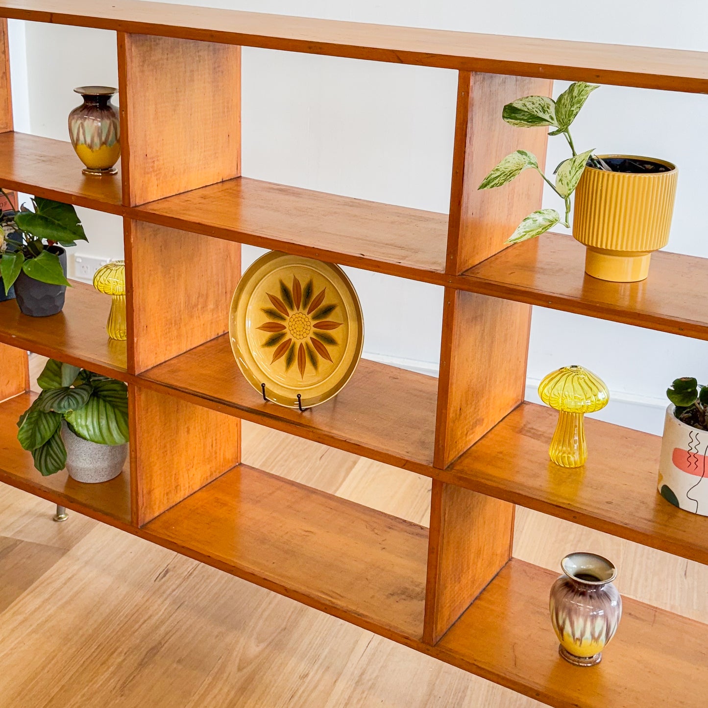 Mid century pigeonhole bookshelf on cigar legs