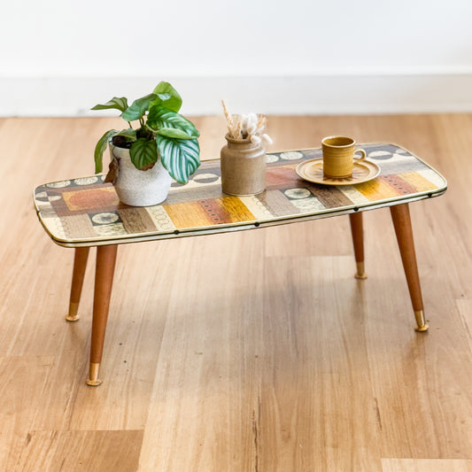 Vintage patterned top coffee table with cigar legs