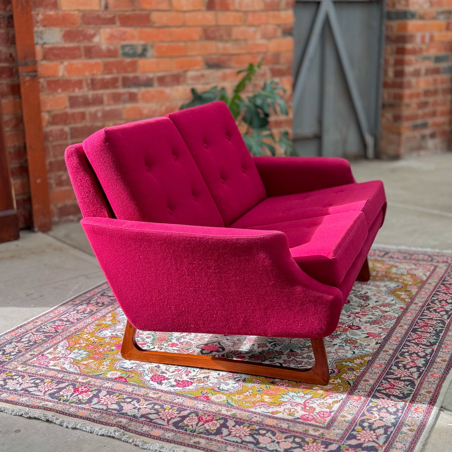 1960s Parker two seater sofa on a sleigh base with exposed dowel detail