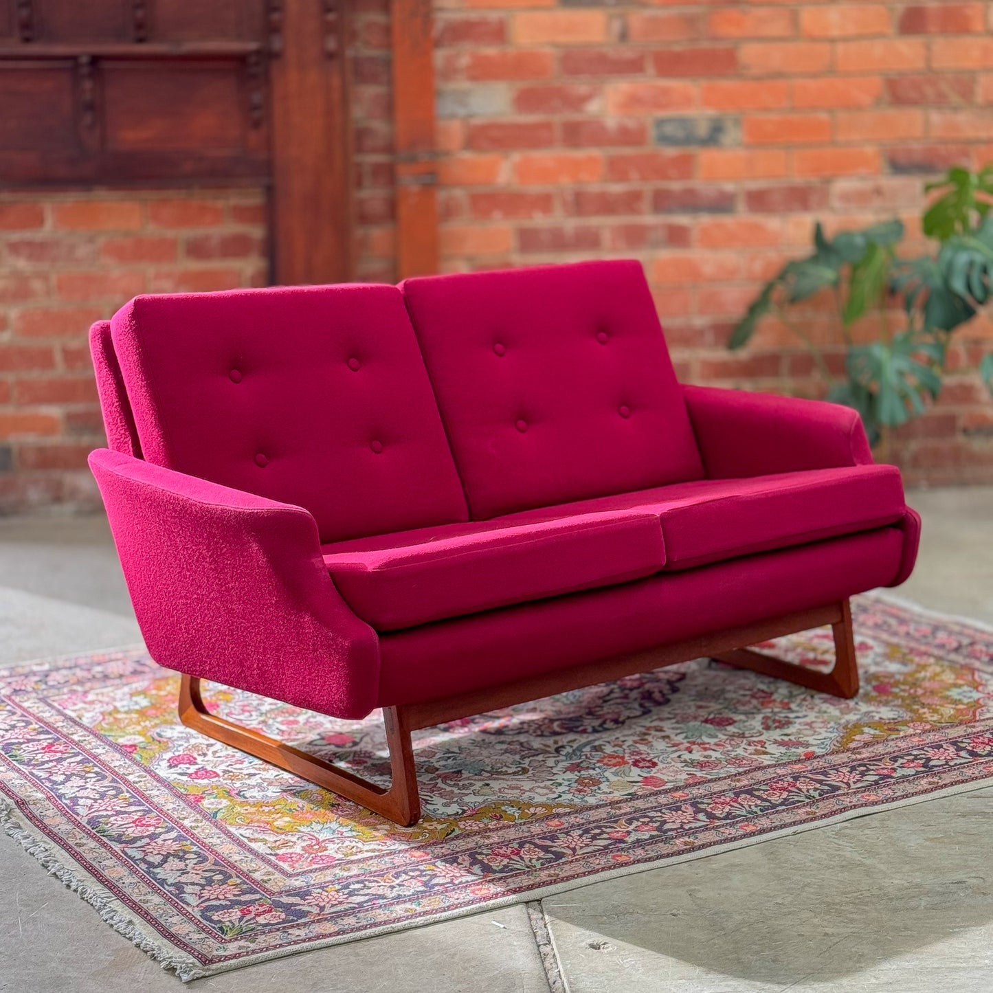 1960s Parker two seater sofa on a sleigh base with exposed dowel detail