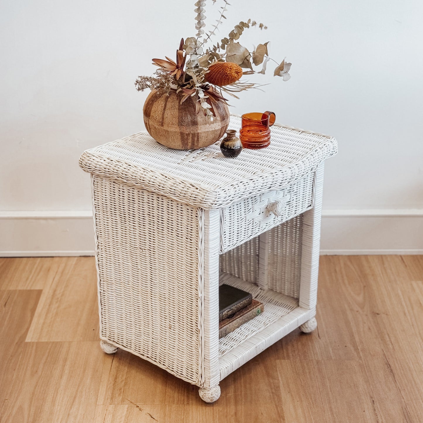 Vintage white painted cane bedside table