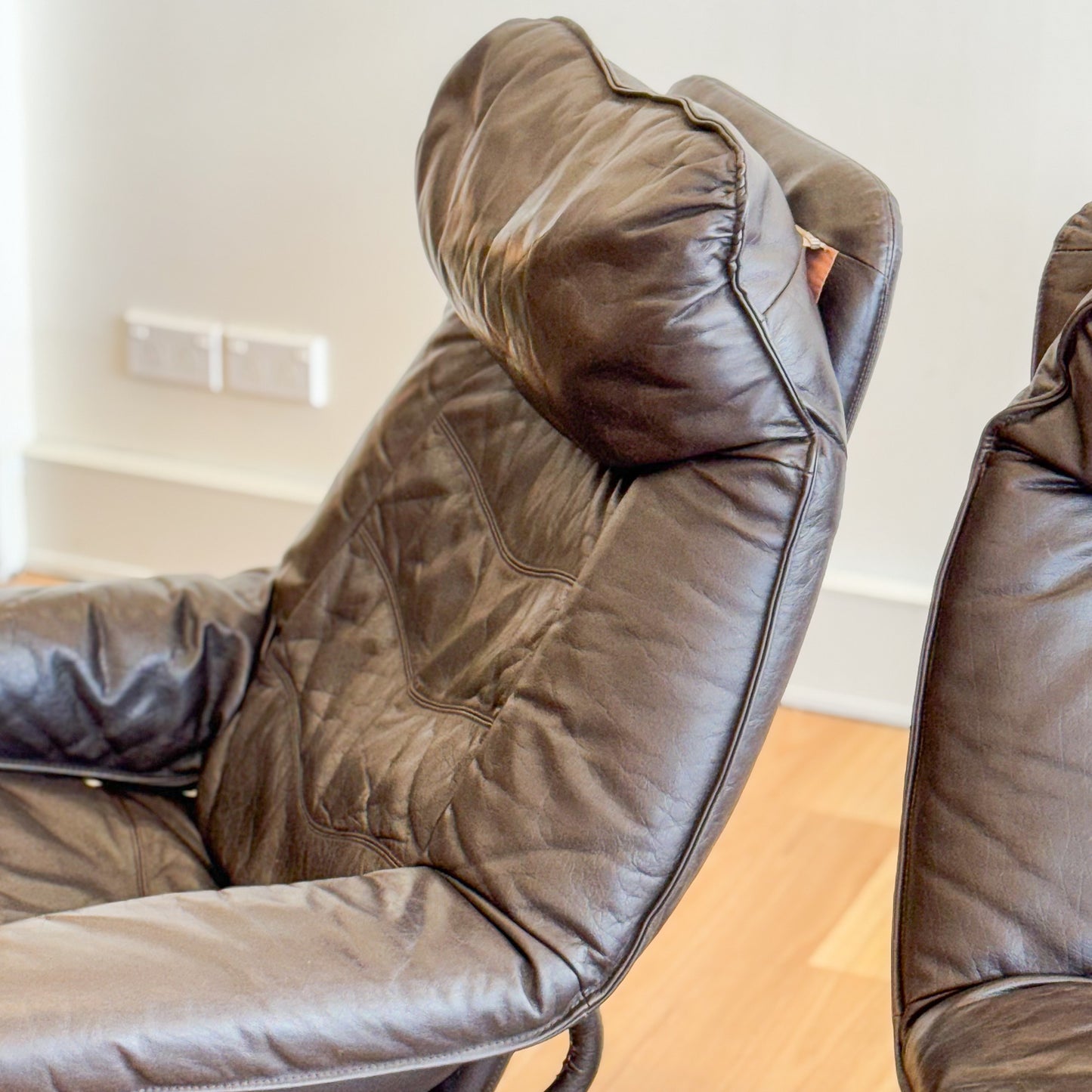 Skoghaug Industries - reclining swivel armchairs upholstered in khaki brown leather